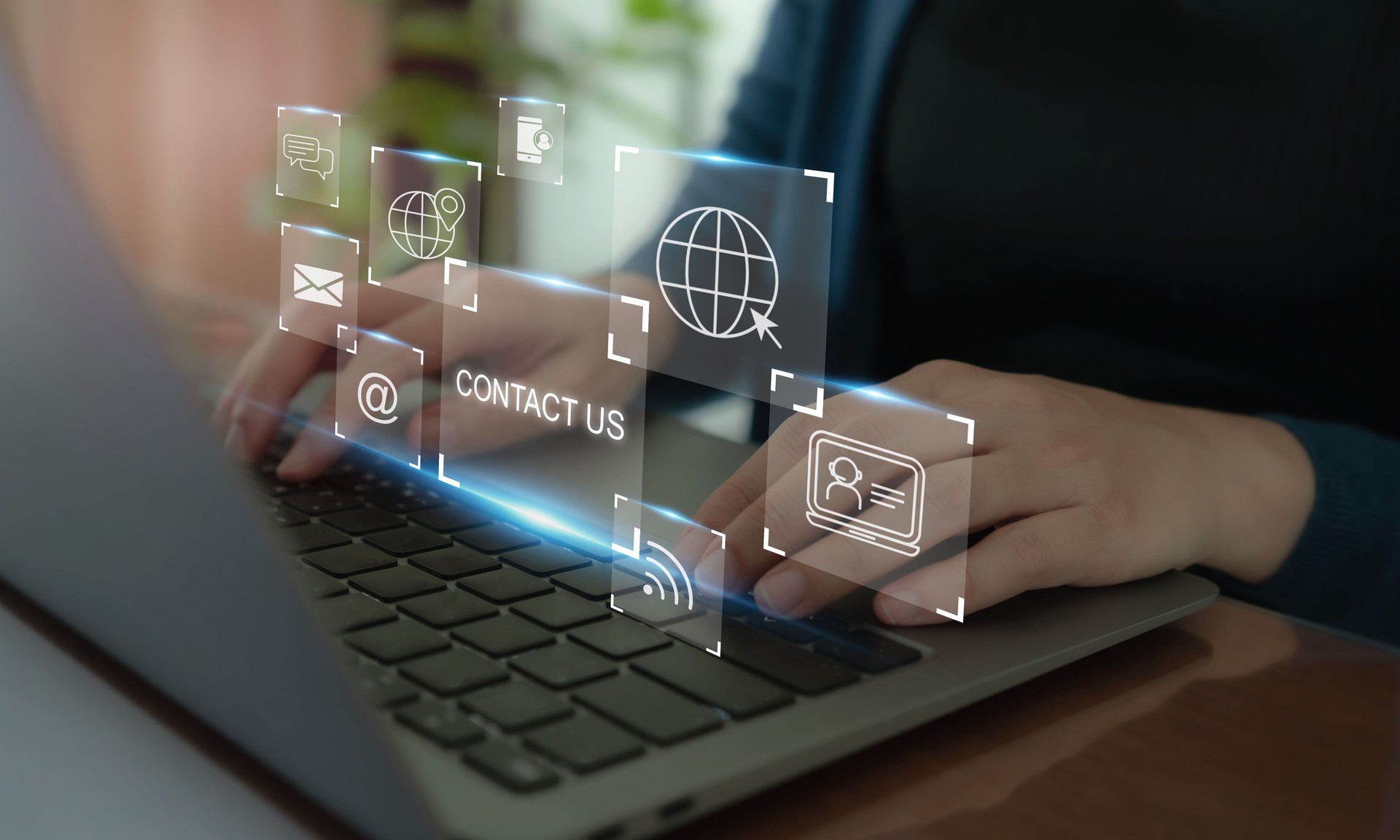 Contact us, customer service channel concept. Using laptop and virtual screen icons of customer contact channels and services (address, phone, email, live chat, self service, social media, video chat)